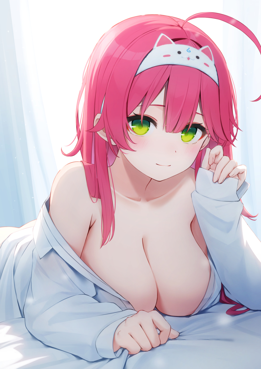 1girl, ahoge, alternate_costume, animal_hairband, bare_shoulders, bed_sheet, breasts, cleavage, closed_mouth, collarbone, commentary_request, green_eyes, hairband, highres, hololive, indoors, large_breasts, long_sleeves, looking_at_viewer, lying, mixed-language_commentary, nyan_(reinyan_007), off_shoulder, on_bed, on_stomach, paid_reward_available, pink_hair, sakura_miko, shirt, sleeves_past_wrists, smile, solo, virtual_youtuber, white_shirt