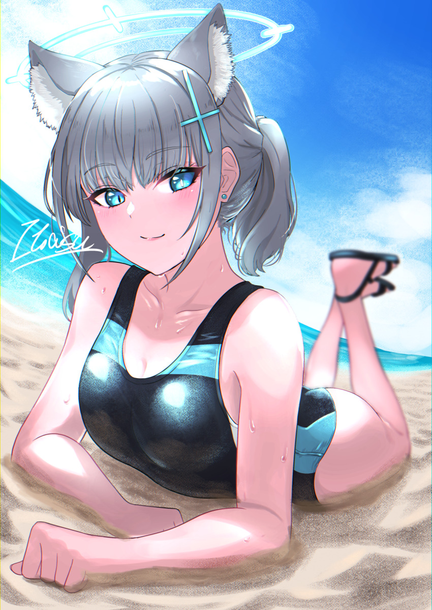 1girl, animal_ear_fluff, animal_ears, beach, black_one-piece_swimsuit, blue_archive, blue_eyes, blue_sky, breasts, cloud, competition_swimsuit, cross_hair_ornament, day, extra_ears, grey_hair, hair_ornament, halo, highres, horizon, looking_at_viewer, low_ponytail, lying, medium_breasts, medium_hair, mismatched_pupils, multicolored_swimsuit, ocean, official_alternate_costume, on_stomach, one-piece_swimsuit, outdoors, ponytail, sand, shiroko_(blue_archive), shiroko_(swimsuit)_(blue_archive), sky, smile, solo, swimsuit, towofuya, wolf_ears
