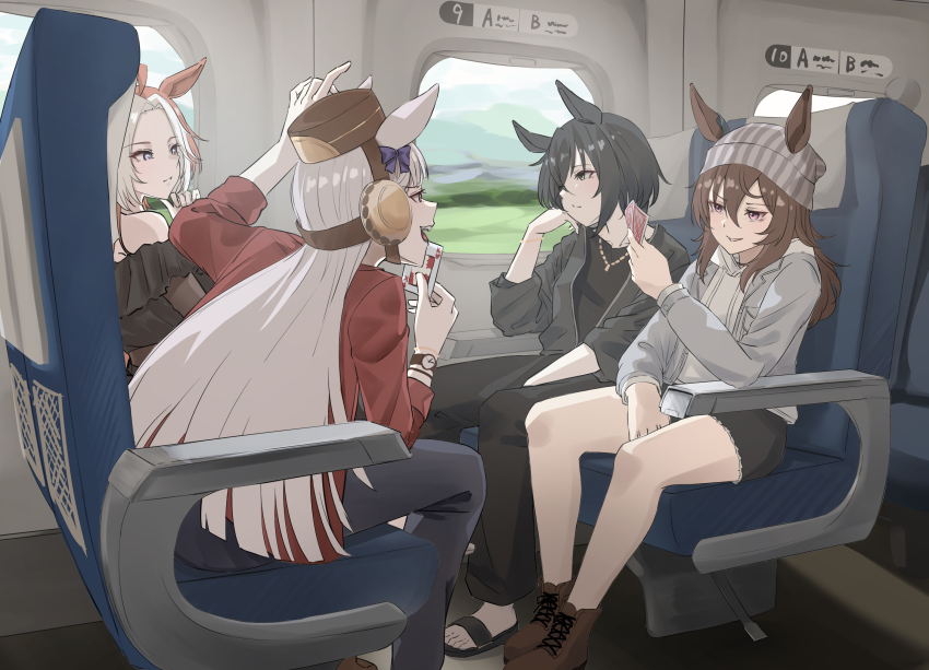 4girls, ahoge, animal_ears, beanie, black_dress, black_hair, black_jacket, black_pants, black_sandals, black_shirt, black_shorts, boots, brown_boots, brown_hair, brown_shoes, card, commentary, dress, ear_covers, ears_through_headwear, frilled_dress, frills, from_side, gold_ship_(umamusume), green_eyes, grey_hair, grey_hat, grey_jacket, hair_between_eyes, hair_intakes, hakekeke2525, hat, highres, holding, holding_card, hood, hooded_sweater, horse_ears, horse_girl, jacket, jewelry, kin'iro_ryotei_(umamusume), long_hair, long_sleeves, looking_at_another, looking_to_the_side, multicolored_hair, multiple_girls, nakayama_festa_(umamusume), necklace, off-shoulder_dress, off_shoulder, orange_hair, orfevre_(umamusume), pants, pillbox_hat, playing_card, purple_eyes, red_jacket, sandals, shirt, shoes, shorts, single_ear_cover, sitting, sweater, train_interior, two-tone_hair, umamusume, umamusume_horse_relations, white_hair