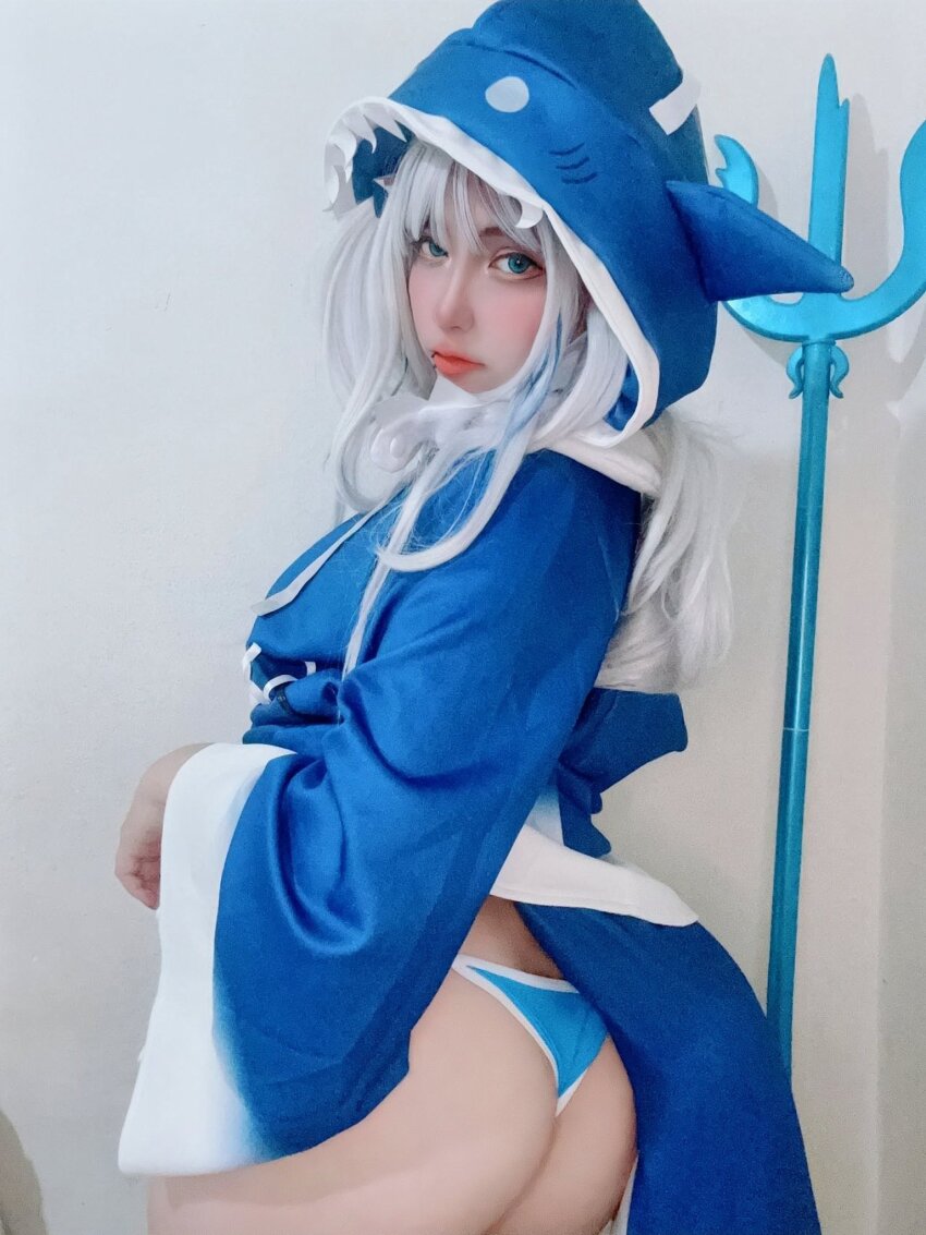 1girl, animal_hood, arelly_trujillo, ass, bikini, blue_bikini, blue_eyes, blue_hair, blue_hoodie, clothes_lift, cosplay, cosplay_photo, cowboy_shot, female_focus, from_behind, gawr_gura, gawr_gura_(1st_costume), gawr_gura_(cosplay), highres, hololive, hololive_english, hood, hood_up, hoodie, hoodie_lift, lifting_own_clothes, lips, long_hair, long_sleeves, looking_at_viewer, looking_back, multicolored_bikini, multicolored_hair, photo_(medium), polearm, real_life, shark_hood, solo, streaked_hair, swimsuit, trident, two-tone_bikini, two-tone_hair, two-tone_hoodie, virtual_youtuber, weapon, white_bikini, white_hair, white_hoodie