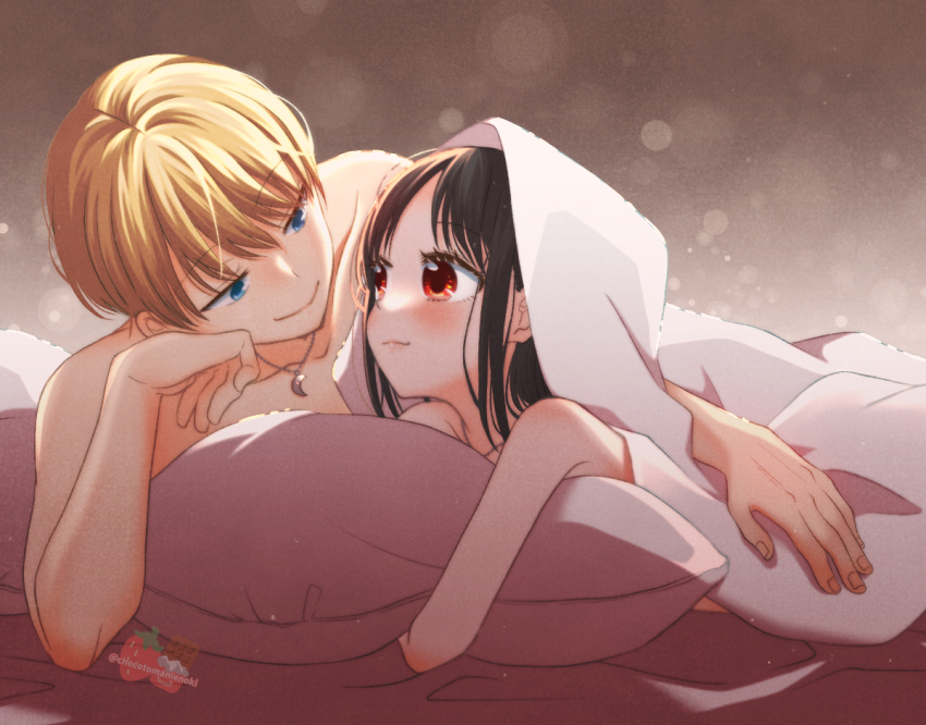 black_hair, blanket, blonde_hair, blush, chocotomamenoki, closed_mouth, couple, crescent, crescent_necklace, eye_contact, hetero, hugging_object, jewelry, kaguya-sama_wa_kokurasetai_~tensai-tachi_no_renai_zunousen~, long_hair, looking_at_another, lying, necklace, on_stomach, pillow, pillow_hug, shinomiya_kaguya, shirogane_miyuki, short_hair, smile