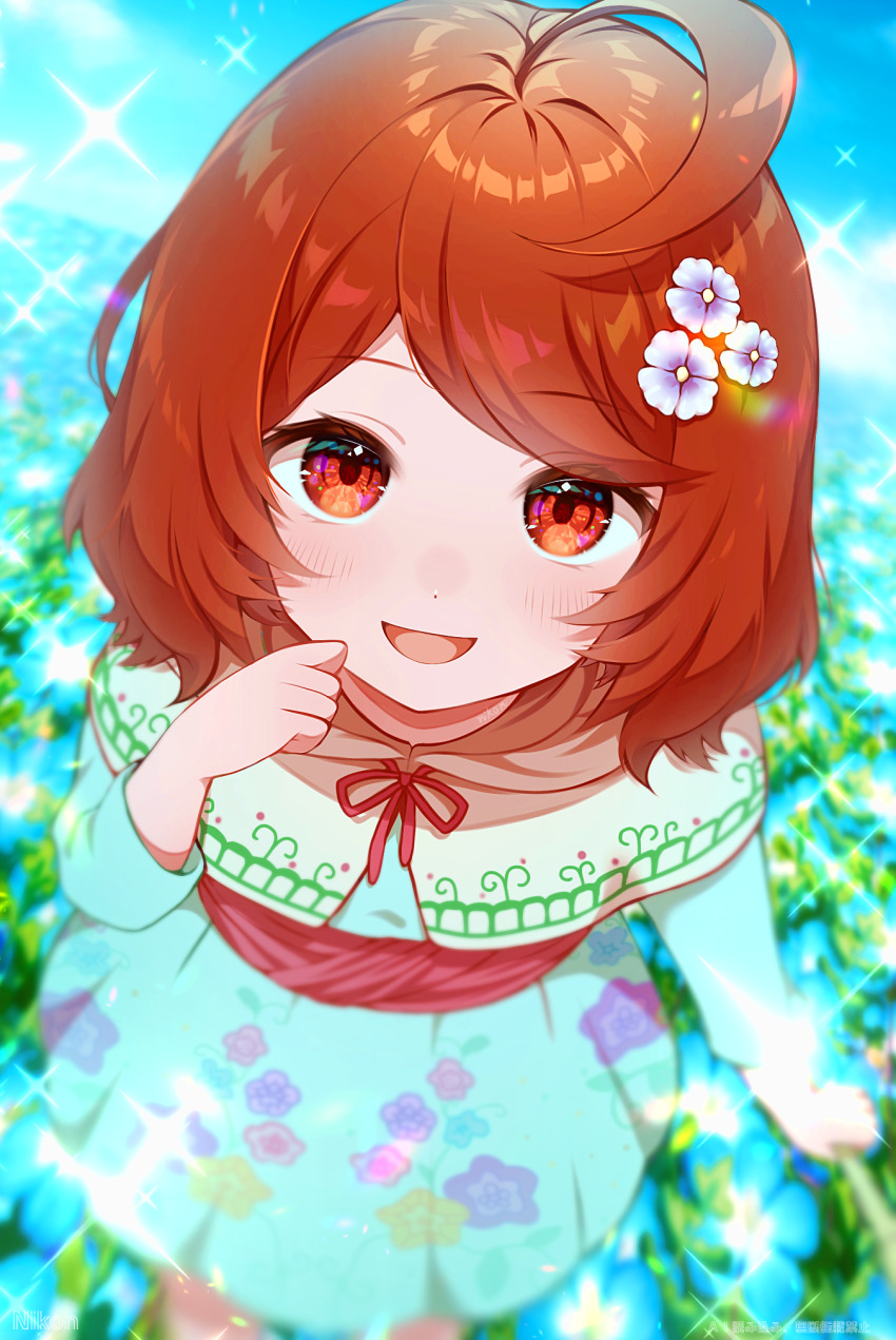 1girl, :d, ahoge, blue_dress, blurry, blurry_background, bob_cut, capelet, commentary_request, depth_of_field, dragon_quest, dragon_quest_x, dress, floral_print, flower, from_above, hair_flower, hair_ornament, highres, looking_at_viewer, meadow, nikon_(user_aznh7528), open_mouth, partial_commentary, porte_(dq10), red_eyes, red_hair, short_hair, smile, solo, sparkle