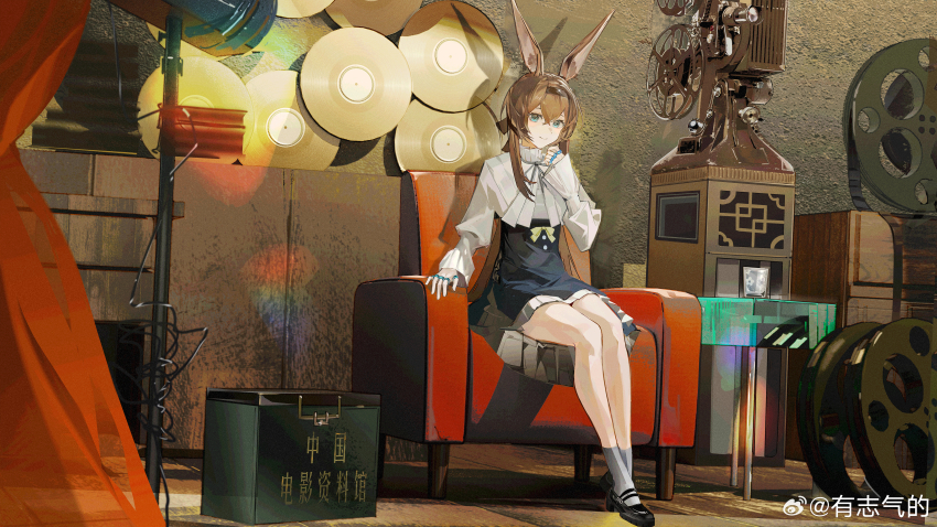 1girl, absurdres, amiya_(arknights), animal_ears, arknights, black_footwear, blue_eyes, bow, box, brown_hair, chair, chinese_commentary, commentary_request, cup, drinking_glass, film_canister, film_reel, grey_ribbon, grey_socks, hairband, high-waist_skirt, high_collar, highres, indoors, jewelry, long_hair, looking_at_viewer, movie_projector, multiple_rings, projector, puffy_sleeves, rabbit_ears, rabbit_girl, ring, shirt, sidelocks, sitting, skirt, smile, socks, stage_lights, table, thumb_ring, translation_request, vinyl_record, white_shirt, yellow_bow, you_zhiqi_de