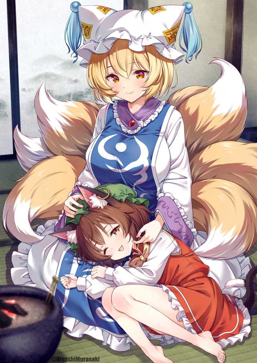 2girls, animal_ear_fluff, animal_ear_piercing, animal_ears, animal_hat, barefoot, blonde_hair, blue_tabard, blurry, bow, bowtie, breasts, brown_eyes, brown_hair, cat_ears, cat_tail, chen, closed_mouth, commentary_request, depth_of_field, earrings, fingernails, fox_tail, frilled_skirt, frills, fusuma, green_hat, hat, hibachi_(object), hibashi, highres, hoop_earrings, indoors, jewelry, kitsune, lap_pillow, long_sleeves, mandarin_collar, mob_cap, multiple_girls, multiple_tails, murasaki_atsushi, nekomata, one_eye_closed, open_mouth, red_skirt, red_vest, single_earring, sitting, skirt, skirt_set, sliding_doors, smile, tabard, tail, tatami, touhou, two_tails, vest, yakumo_ran, yellow_bow, yellow_bowtie, yellow_eyes