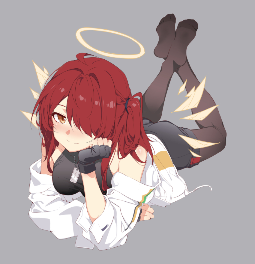 1girl, ahoge, arknights, back_peek, bare_shoulders, black_pantyhose, breasts, crossed_ankles, exusiai_(arknights), exusiai_(teenage)_(arknights), exusiai_the_new_covenant_(arknights), full_body, hair_over_one_eye, halo, highres, jacket, kataokasan, long_hair, looking_at_viewer, lying, no_shoes, on_stomach, pantyhose, red_eyes, red_hair, shirt, shorts, side_ponytail, small_breasts, smile, solo, t-shirt, the_pose, wings