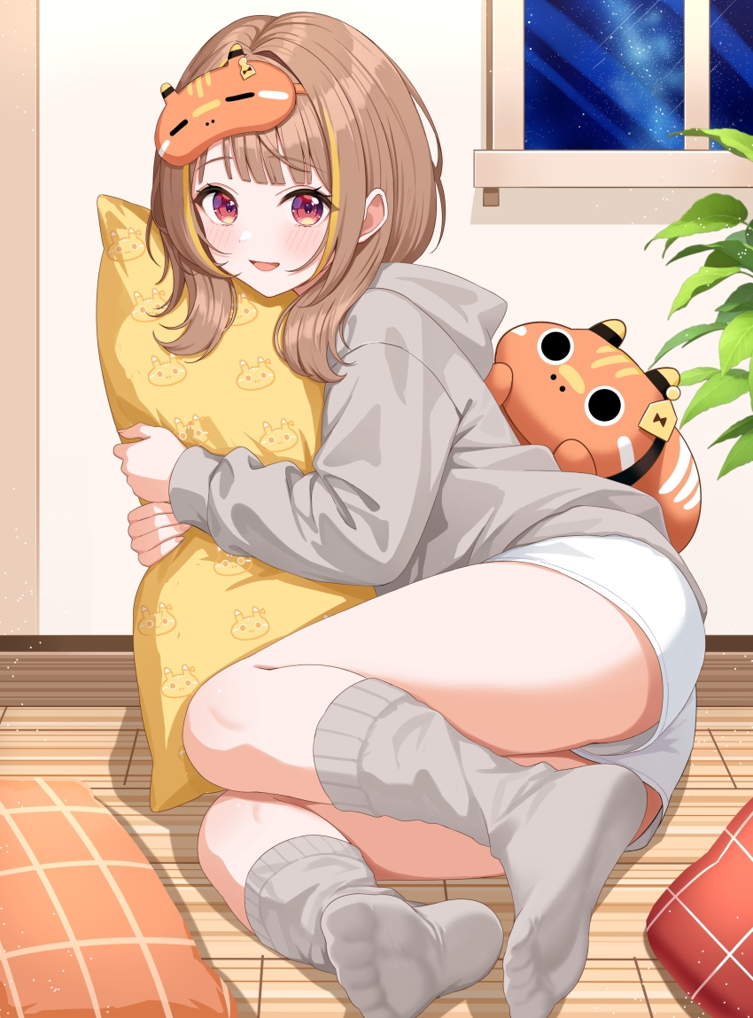 1girl, :d, absurdres, blonde_hair, brown_hair, commentary_request, full_body, grey_hoodie, grey_socks, highres, hood, hoodie, hugging_object, indoors, long_sleeves, looking_at_viewer, mask, mask_on_head, medium_hair, multicolored_hair, night, no_shoes, official_alternate_costume, open_mouth, pillow, pillow_hug, sendo_yuuhi, sendo_yuuhi_(loungewear), short_shorts, shorts, sleep_mask, sleeves_past_wrists, smile, socks, solo, streaked_hair, sunamama4788, virtual_youtuber, vspo!, white_shorts, wooden_floor