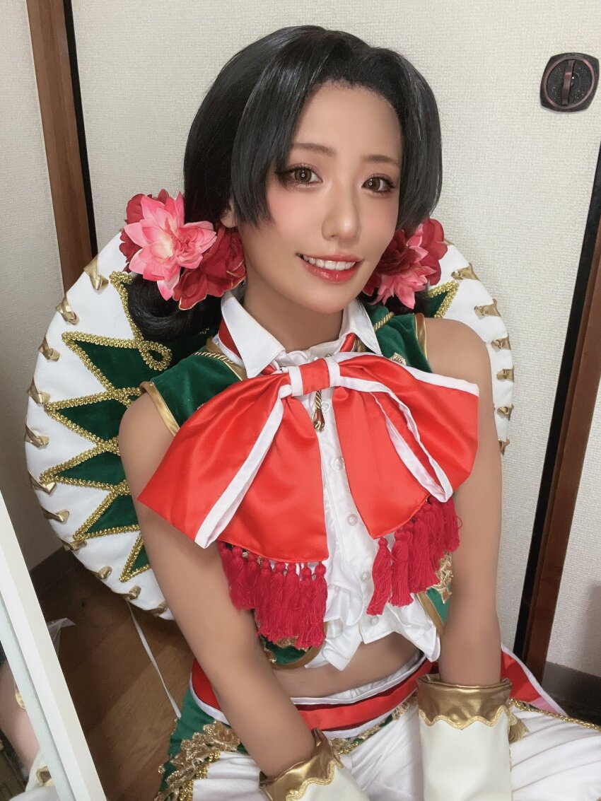1girl, brown_hair, cosplay, cosplay_photo, crop_top, east_asian, flower, hair_bun, hair_flower, hair_ornament, hat, highres, lily_hawk, lily_hawk_(cosplay), long_hair, looking_at_viewer, mexican_clothes, photo_(medium), real_life, sleeveless, street_fighter, street_fighter_6, ukaru1207