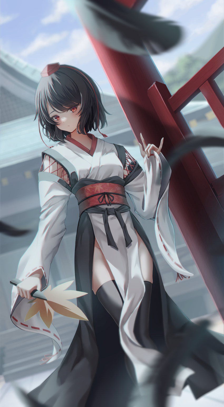 1girl, black_hair, black_thighhighs, blue_sky, blurry, depth_of_field, fall_(5754478), falling_feathers, feathers, hand_fan, hat, highres, holding, holding_fan, kourindou_tengu_costume, looking_at_viewer, obi, outdoors, red_eyes, sash, shameimaru_aya, short_hair, shrine, sky, solo, thighhighs, thighs, tokin_hat, touhou, wide_sleeves