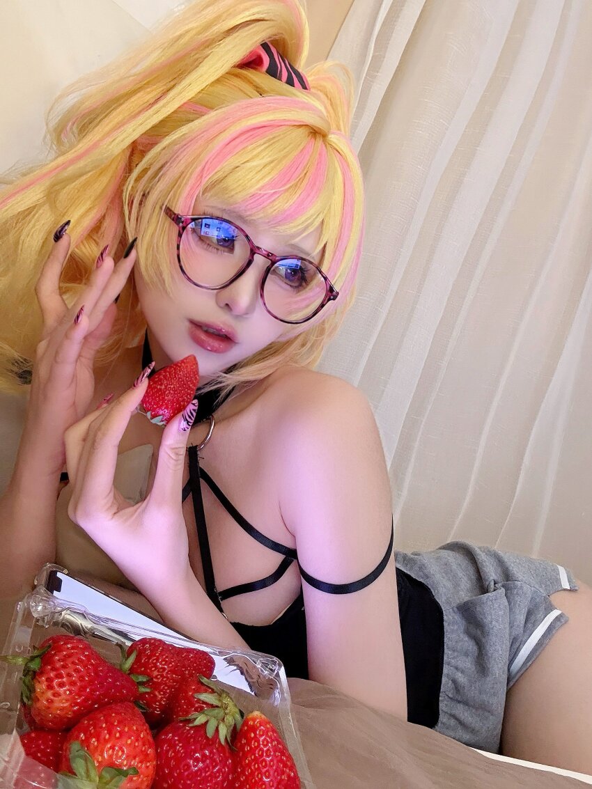 1girl, absurdres, adjusting_eyewear, armpit_crease, black_camisole, black_nails, blonde_hair, blue_eyes, camisole, choker, cosplay, cosplay_photo, food, fruit, grey_shorts, gyaru, hair_ornament, hair_scrunchie, highres, kikuro_815, kotoka_torahime, kotoka_torahime_(3rd_costume), looking_to_the_side, lying, multicolored_nails, nail_polish, nijisanji, nijisanji_en, o-ring, o-ring_choker, o-ring_top, official_alternate_costume, official_alternate_hairstyle, on_side, photo_(medium), pink_lips, pink_nails, pink_streaks, round_eyewear, scrunchie, shorts, single_off_shoulder, spaghetti_strap, strap, strawberry, virtual_youtuber