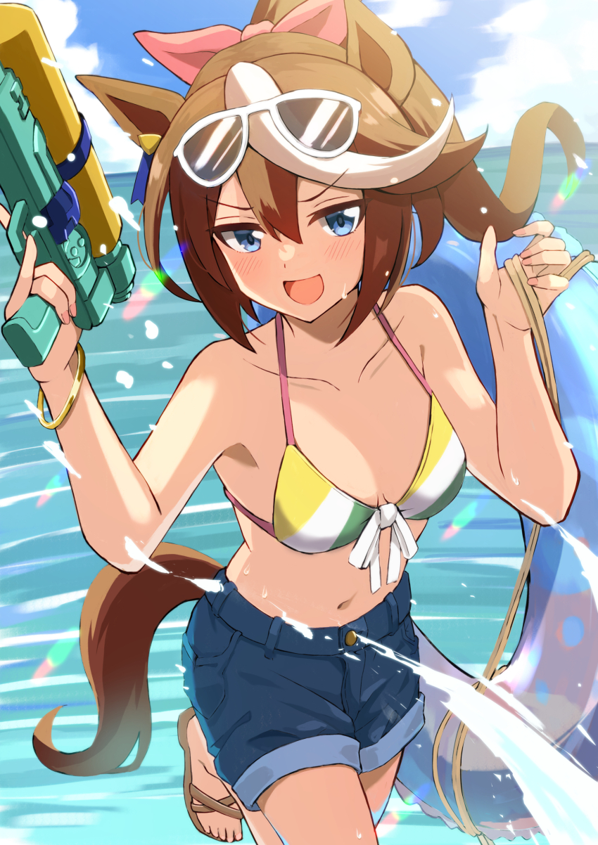 1girl, :d, absurdres, animal_ears, bikini, blue_shorts, blue_sky, blush, breasts, cleavage, cloud, collarbone, commentary_request, day, eyewear_on_head, hair_between_eyes, hair_ribbon, highres, holding, holding_water_gun, horse_ears, horse_girl, horse_tail, looking_at_viewer, medium_breasts, ocean, open_mouth, outdoors, pink_ribbon, ponytail, ribbon, seiji_(artman), shorts, sky, smile, solo, sunglasses, swimsuit, tail, tokai_teio_(umamusume), umamusume, water_gun