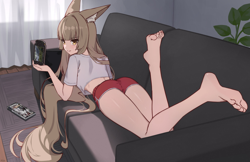 1girl, absurdres, animal_ears, ass, barefoot, brown_eyes, brown_hair, couch, feet, handheld_game_console, highres, light_blush, long_hair, looking_at_viewer, lying, monster_hunter_(series), monster_hunter_freedom_unite, nia_(xenoblade), on_stomach, parted_lips, playstation_portable, short_shorts, shorts, soles, toes, x_xith_x, xenoblade_chronicles_(series), xenoblade_chronicles_2