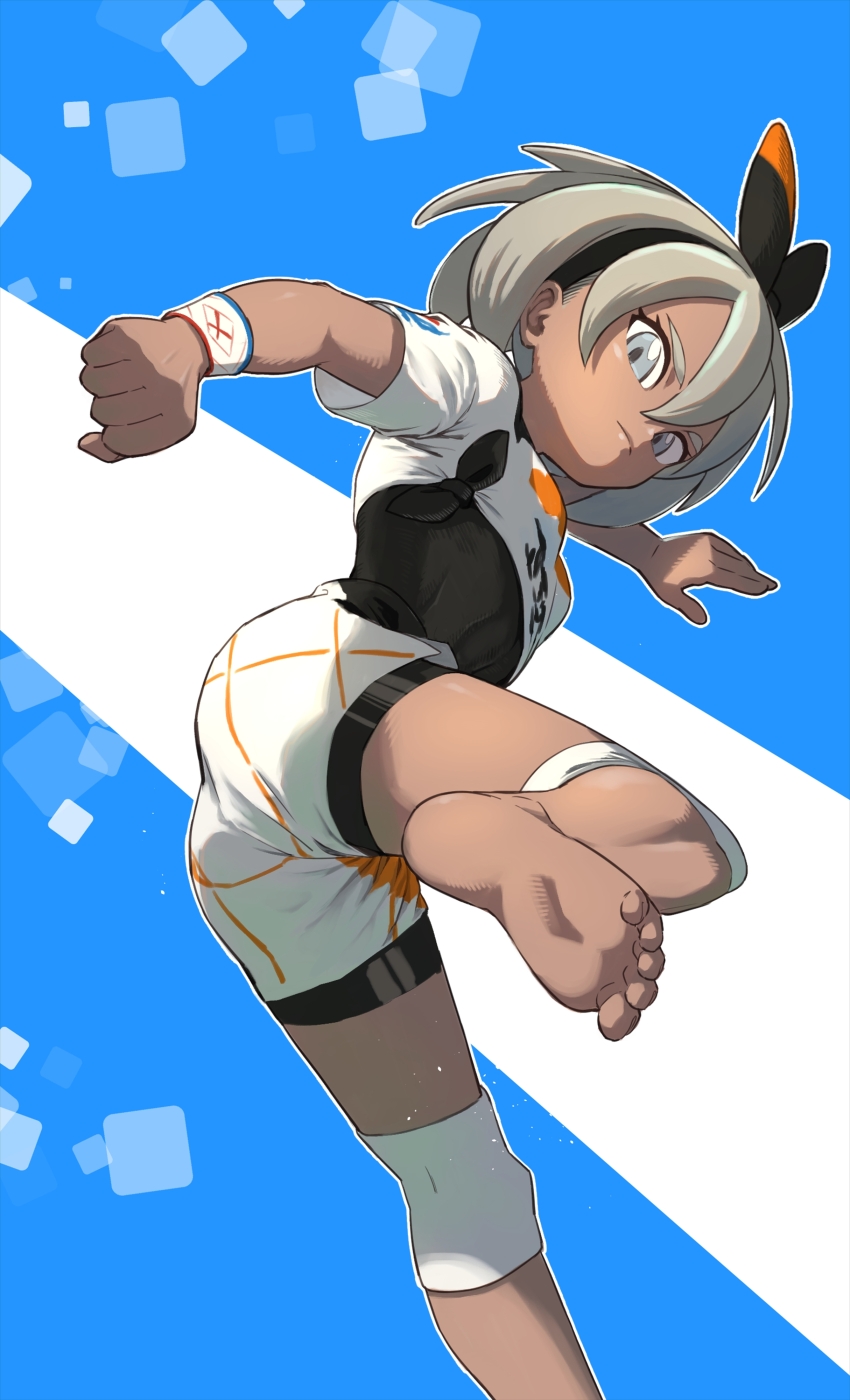 1girl, absurdres, barefoot, bea_(pokemon), black_bodysuit, black_hairband, blonde_hair, bodysuit, bodysuit_under_clothes, bow_hairband, clenched_hand, closed_mouth, commentary, dynamax_band, eyelashes, feet, foot_out_of_frame, grey_eyes, hair_between_eyes, hairband, highres, iroiro_yaru_hito, knee_pads, leg_up, looking_at_viewer, nintendo, pokemon, pokemon_sword_and_shield, print_shirt, shirt, short_hair, short_sleeves, shorts, soles, solo, tied_shirt, toes, white_shirt, white_shorts