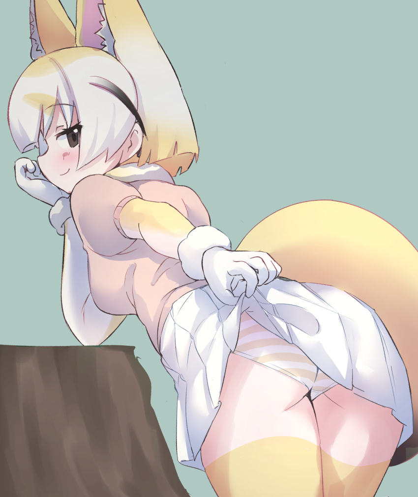 1girl, absurdres, animal_ears, back, black_eyes, blonde_hair, blush, cardigan, elbow_gloves, extra_ears, fennec_(kemono_friends), fox_ears, fox_girl, fox_tail, gloves, grey_background, highres, kemono_friends, looking_at_viewer, looking_back, lowlandgorilla, panties, short_hair, simple_background, skirt, solo, tail, thighhighs, underwear