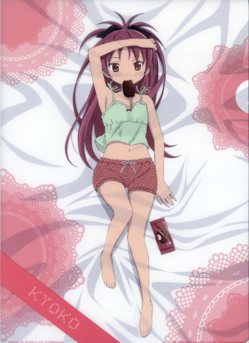 1girl, :3, absurdres, arm_on_own_head, bed_sheet, bow, character_name, child, food, food_in_mouth, food_wrapper, full_body, green_tank_top, hair_bow, highres, incredibly_absurdres, lying, mahou_shoujo_madoka_magica, non-web_source, official_art, on_back, on_bed, pajamas, ponytail, popsicle, popsicle_in_mouth, red_eyes, red_hair, red_shorts, sakura_kyoko, scan, self-scan, shorts, solo, tank_top