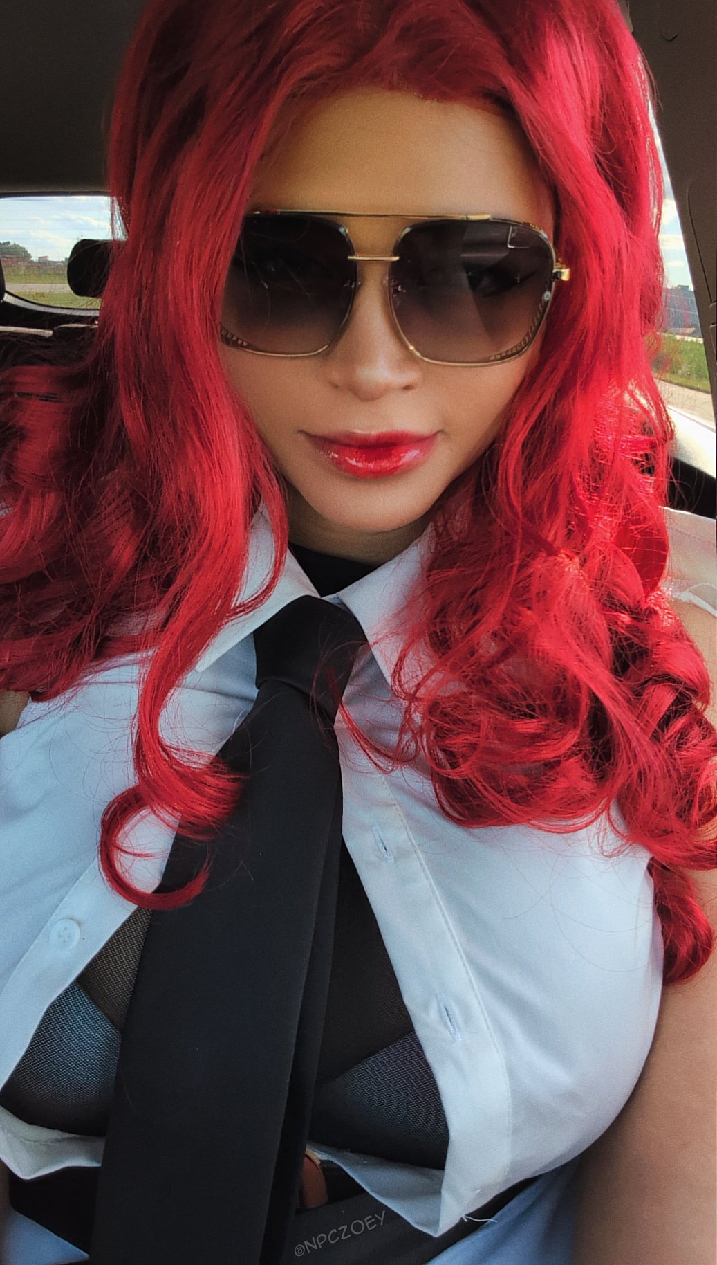 1girl, artist_name, black_gloves, black_necktie, breasts, capcom, car_interior, closed_mouth