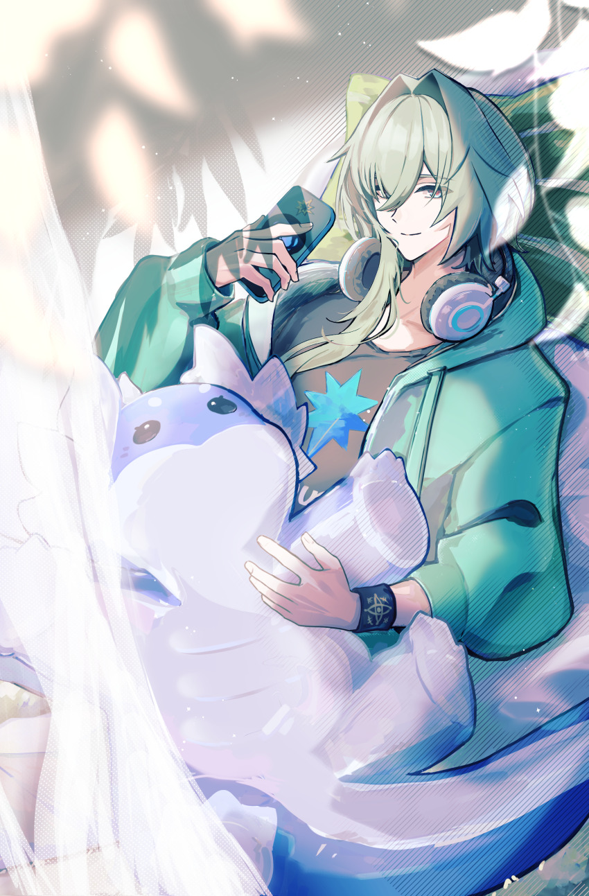 1boy, 3vvv3, absurdres, alternate_costume, anaxa_(alternate_spacetime)_(honkai:_star_rail), anaxa_(honkai:_star_rail), black_shirt, blue_eyes, casual, cellphone, closed_mouth, commentary, curtains, dromas_(honkai:_star_rail), green_hair, green_jacket, hair_between_eyes, hair_intakes, hair_over_shoulder, head_on_pillow, headphones, headphones_around_neck, highres, holding, holding_phone, holding_stuffed_toy, honkai:_star_rail, honkai_(series), hood, hooded_jacket, jacket, long_hair, looking_at_viewer, lying, male_focus, on_back, phone, pill, pillow, pink_pupils, ponytail, shirt, smartphone, smile, solo, stuffed_animal, stuffed_toy, untranslatable_commentary, t-shirt, wristband