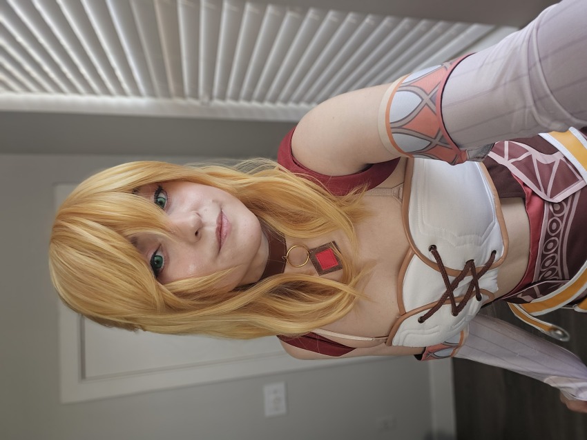 1girl, bare_shoulders, blonde_hair, breasts, brown_skirt, clothing_cutout, cosplay, detached_sleeves