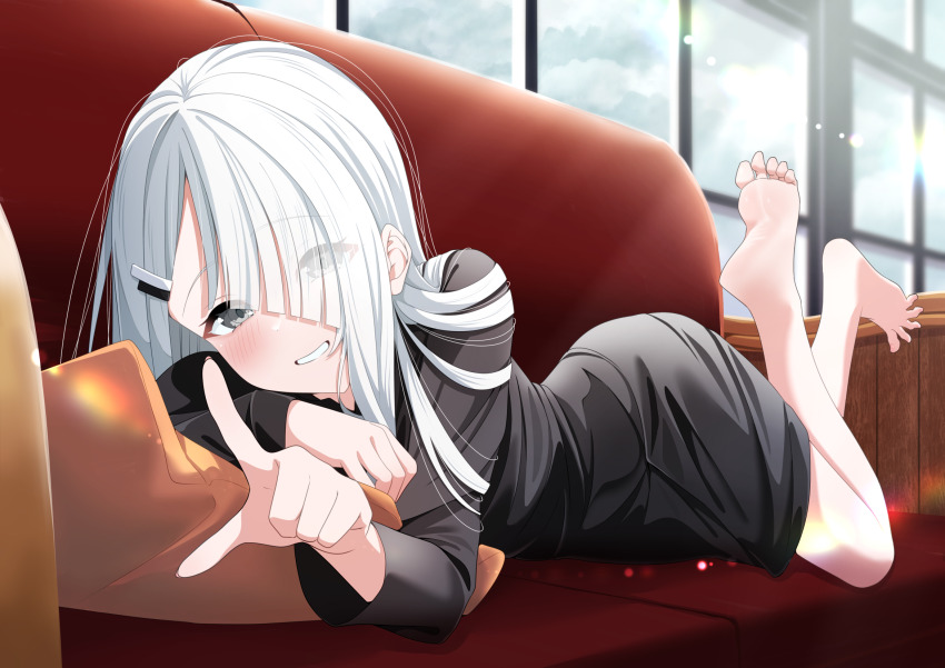 1girl, barefoot, blush, couch, feet, grey_eyes, grin, hair_over_one_eye, highres, long_hair, looking_at_viewer, lying, mikami_makoto_(makot0_01), noir_(noworld), noworld, on_stomach, pointing, smile, soles, toes, white_hair