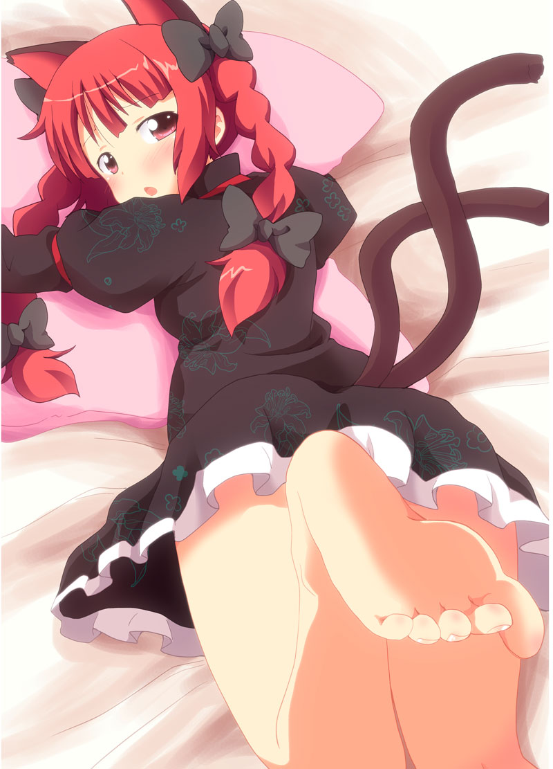 1girl, animal_ears, barefoot, bed_sheet, blush, braid, cat_ears, cat_girl, cat_tail, dress, extra_ears, feet, female_focus, foot_focus, kaenbyou_rin, lying, massala, multiple_tails, hugging_object, on_stomach, pillow, pillow_hug, red_eyes, red_hair, ribbon, soles, solo, tail, toe_scrunch, toenails, toes, touhou, twin_braids, twintails