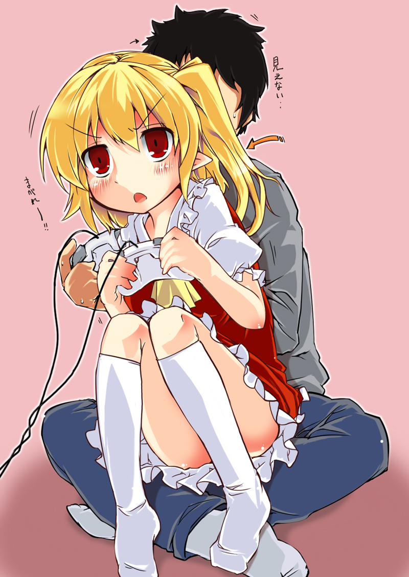 1boy, 1girl, ascot, bad_id, bad_pixiv_id, black_hair, blonde_hair, blush, controller, dress, flandre_scarlet, game_controller, harry_(namayake), long_sleeves, missing_headwear, missing_wings, open_mouth, pants, pink_background, playing_games, playing_video_games, pointy_ears, puffy_sleeves, red_dress, red_eyes, red_skirt, short_hair, short_sleeves, side_ponytail, simple_background, sitting, sitting_on_lap, sitting_on_person, skirt, touhou