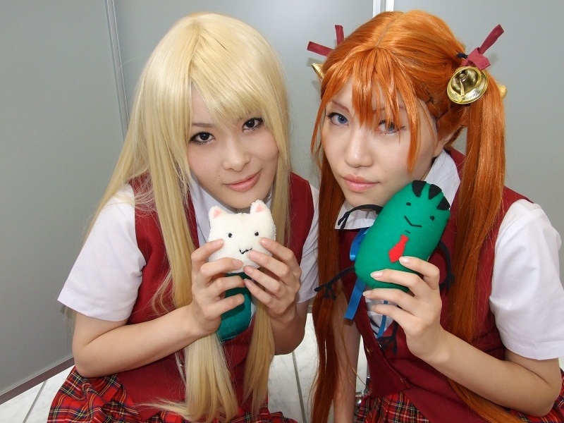 2girls, bell, blonde_hair, cosplay, hair_ribbon, kagurazaka_asuna, kneehighs, mahou_sensei_negima!, mio_(cosplayer), multiple_girls, photo_(medium), ribbon, rou_(cosplayer), school_uniform, socks, stuffed_animal, stuffed_toy, twintails, yukihiro_ayaka