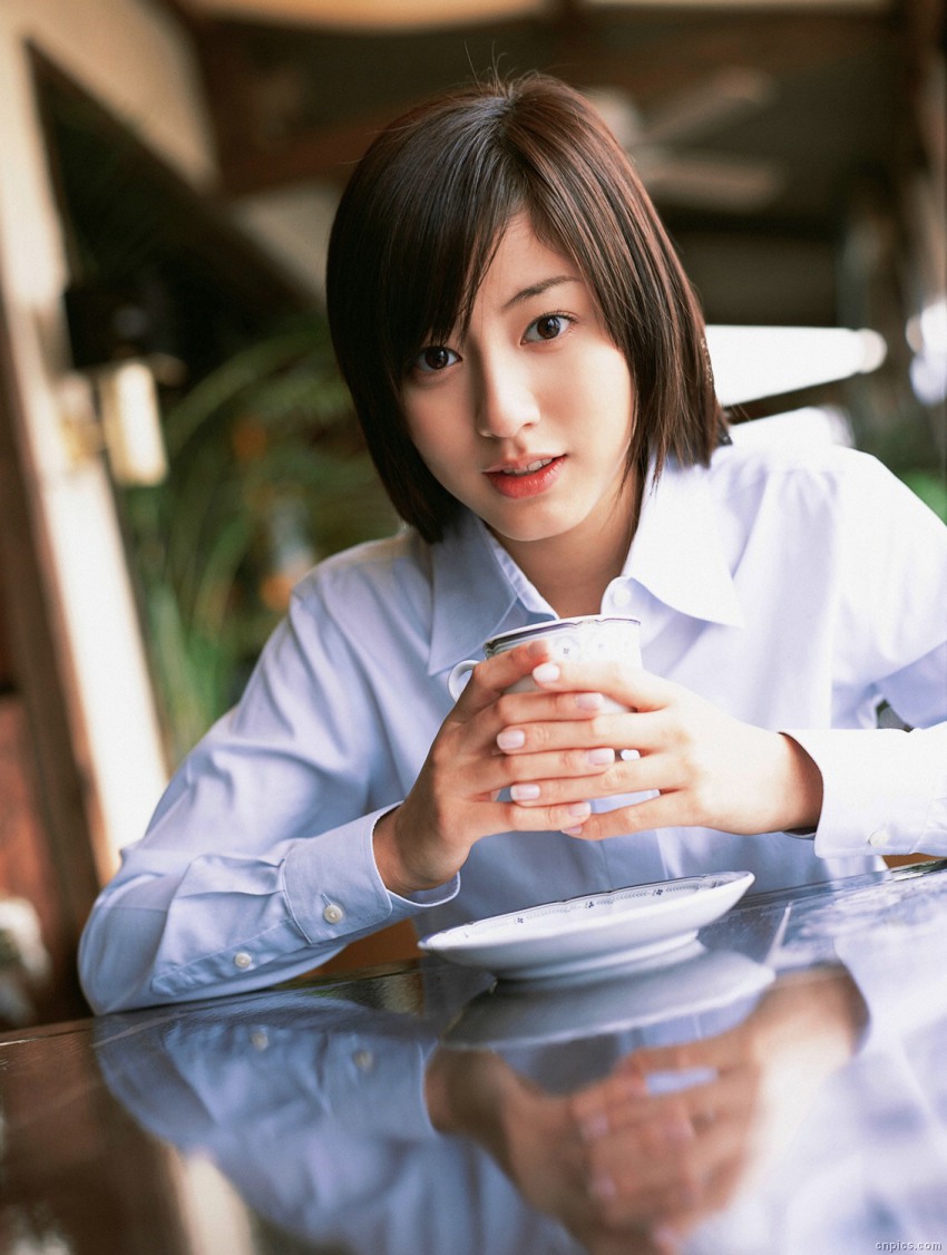 1girl, brown_hair, cosplay, dutch_angle, east_asian, female_focus, highres, long_hair, looking_at_viewer, photo_(medium), school_uniform, solo, sugimoto_yumi, tea_shop