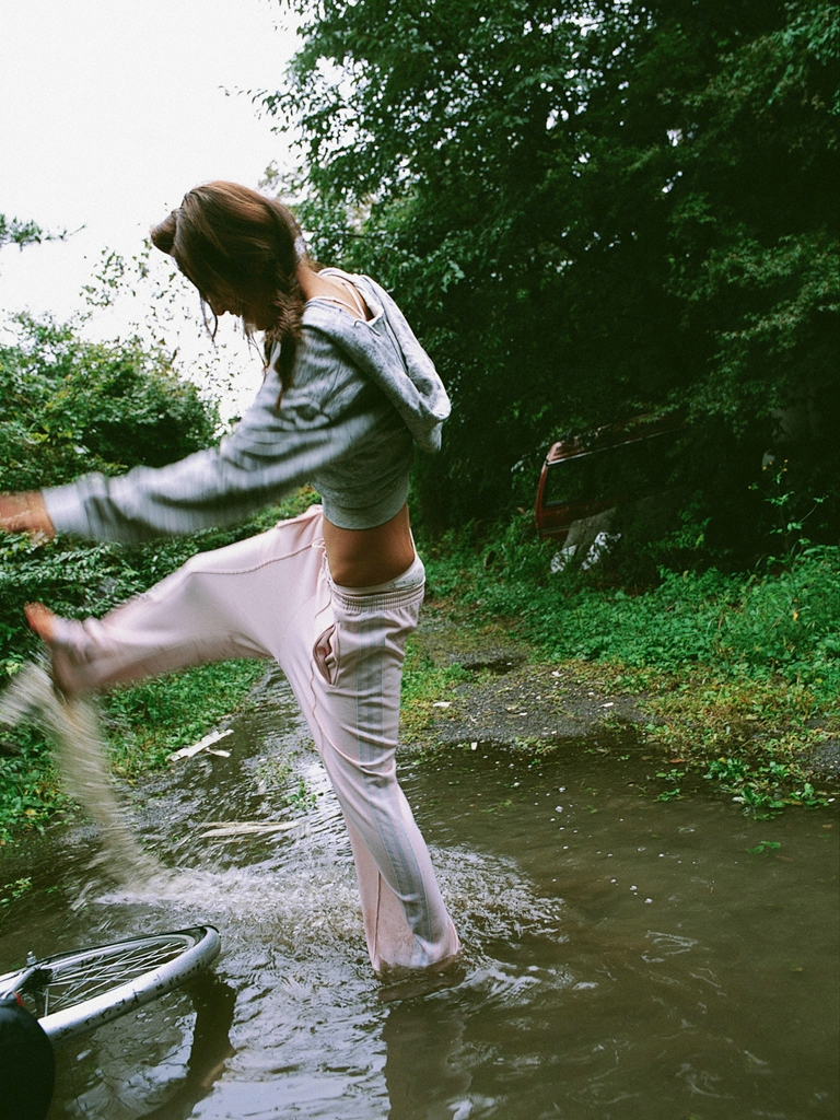 ando_sayaka, bicycle, hood, hoodie, mud, photo_(medium), pond, running_pants