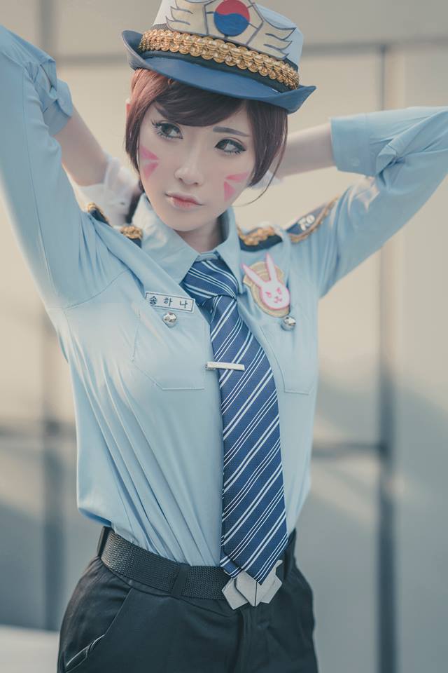 1girl, adjusting_hair, arms_up, belt, breast_pocket, breasts, brown_hair, cosplay