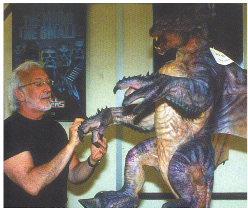 1boy, carlos_huante, claws, cut_content, facial_hair, giant, giant_monster, glasses, godzilla_(series), godzilla_(unmade_1994_u.s._film), grey_hair, gryphon_(godzilla), hooves, horns, kaiju, model_kit, monster, movie_poster_(medium), official_art, real_life, sculpture, small_soldiers, stan_winston, stan_winston_studio, toho, tristar_pictures, wings