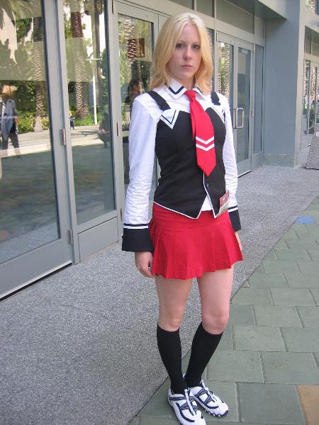 1girl, bible_black, blonde_hair, cosplay, cosplay_photo, female_focus, kneehighs, mephisto, necktie, photo_(medium), school_uniform, serafuku, shoes, skirt, sneakers, socks, solo