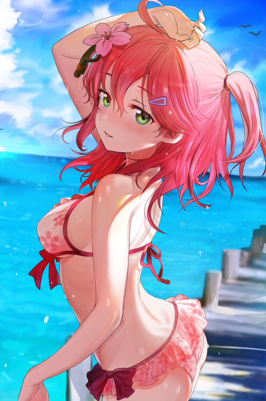 1girl, absurdres, ahoge, arm_up, ass, bare_arms, bare_shoulders, bikini, bikini_skirt, blurry, breasts, butt_crack, cloud, cowboy_shot, day, depth_of_field, female_focus, floral_print, flower, front-tie_bikini_top, front-tie_top, green_eyes, hair_flower, hair_ornament, hairclip, halterneck, highres, hololive, long_hair, looking_at_viewer, medium_breasts, ocean, official_alternate_costume, one_side_up, outdoors, parted_lips, pier, pink_bikini, pink_flower, print_bikini, red_hair, sakura_miko, sakura_miko_(hololive_summer_2019), seicoh, sideboob, solo, sunlight, swimsuit, virtual_youtuber, water, wet