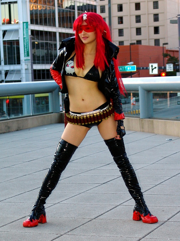 bikini, bikini_top_only, boots, breasts, cleavage, cosplay, cosplay_photo, double_k, large_breasts, long_hair, midriff, orange-tinted_eyewear, orange-tinted_glasses, otakon, photo_(medium), ponytail, red_hair, shorts, sunglasses, swimsuit, tengen_toppa_gurren_lagann, thighs, tinted_eyewear, visor, yoko_littner