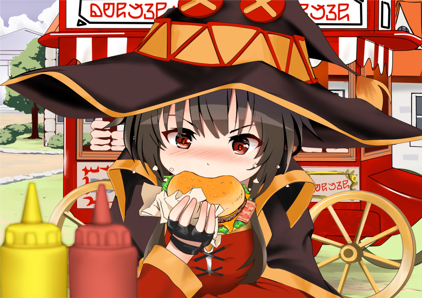 1girl, black_cape, black_gloves, black_hair, black_hat, blurry, blurry_foreground, blush, burger, cape, commentary_request, day, depth_of_field, dress, fingerless_gloves, food, gibun_(sozoshu), gloves, hand_up, hat, highres, holding, holding_food, ketchup_bottle, kono_subarashii_sekai_ni_shukufuku_wo!, long_hair, long_sleeves, megumin, mustard_bottle, nose_blush, outdoors, red_dress, red_eyes, sidelocks, solo, v-shaped_eyebrows, vending_cart, witch_hat