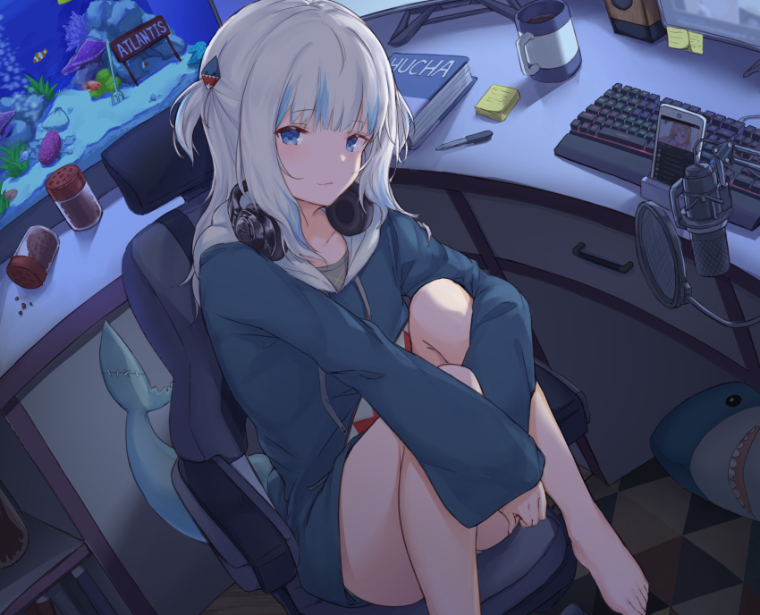 1girl, barefoot, blue_eyes, blue_hair, blue_hoodie, book, cellphone, chair, collarbone, cup, desk, drawer, fins, fish_food, fish_tail, fish_tank, gaming_chair, gawr_gura, gawr_gura_(1st_costume), hair_ornament, headphones, headphones_around_neck, highres, hololive, hololive_english, hood, hoodie, keyboard, knees_up, long_sleeves, looking_at_viewer, medium_hair, microphone, monitor, mug, multicolored_hair, office_chair, pen, phone, pop_filter, shark, shark_girl, shark_tail, shiunnkaku, sitting, smartphone, smile, solo, speaker, sticky_note, streaked_hair, swivel_chair, tail, thighs, two_side_up, virtual_youtuber, white_hair