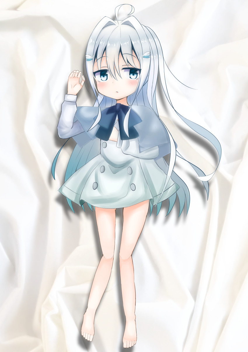 1girl, absurdres, barefoot, bed, blue_bow, blue_capelet, blue_eyes, blush, bow, capelet, dakimakura_(medium), dress, grey_dress, grey_hair, hair_ornament, highres, kanna_shizuku, long_hair, long_sleeves, looking_at_viewer, lying, open_mouth, original, wing_hair_ornament