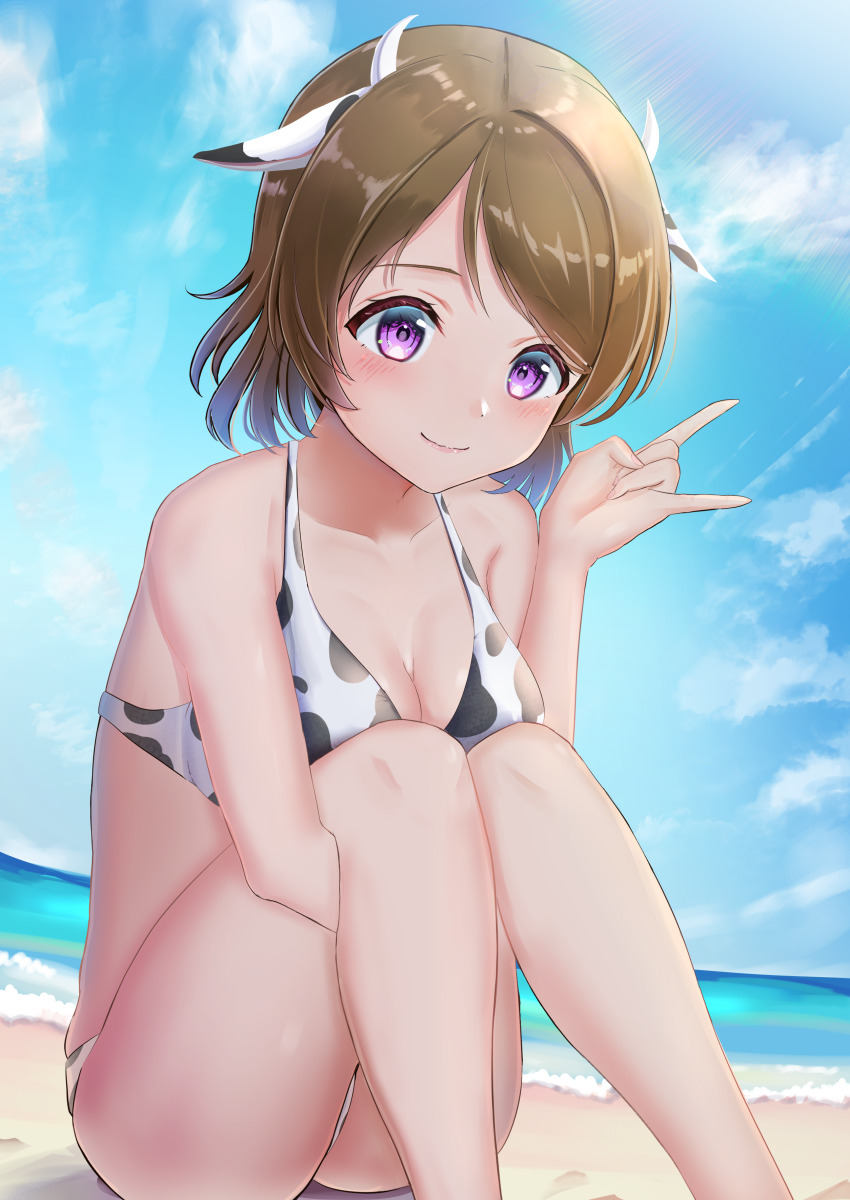 1girl, absurdres, animal_ears, animal_print, artist_name, artist_request, bare_legs, bare_shoulders, beach, blue_sky, blush, breasts, brown_hair, cleavage, cloud, collarbone, cow_ears, cow_print, cow_print_bikini, day, female_focus, hair_between_eyes, hands_between_legs, highres, koizumi_hanayo, love_live!, love_live!_school_idol_project, medium_breasts, ocean, outdoors, panaham, parted_lips, print_bikini, purple_eyes, short_hair, sitting, sky, smile, solo