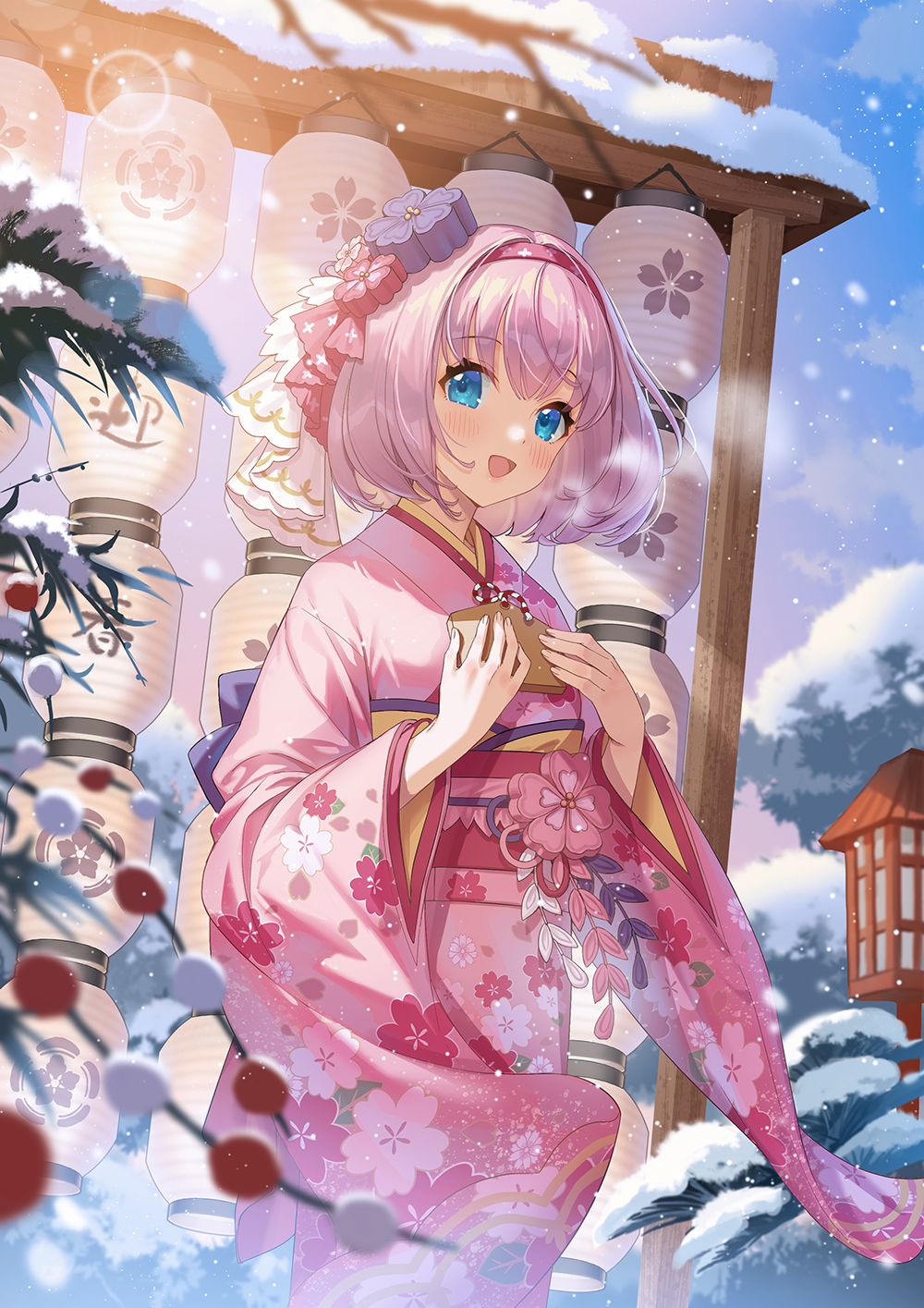1girl, :d, blue_eyes, blurry, blurry_foreground, blush, breasts, commentary_request, cowboy_shot, day, depth_of_field, ema, floral_print, furisode, hair_ornament, hairband, highres, holding, holding_ema, japanese_clothes, kimono, lantern, lens_flare, long_sleeves, majiang, motion_blur, obi, open_mouth, outdoors, paper_lantern, pink_hair, pink_hairband, pink_kimono, princess_connect!, print_kimono, sash, short_hair, smile, snow, snowing, solo, wide_sleeves, winter, yui_(new_year)_(princess_connect!), yui_(princess_connect!)