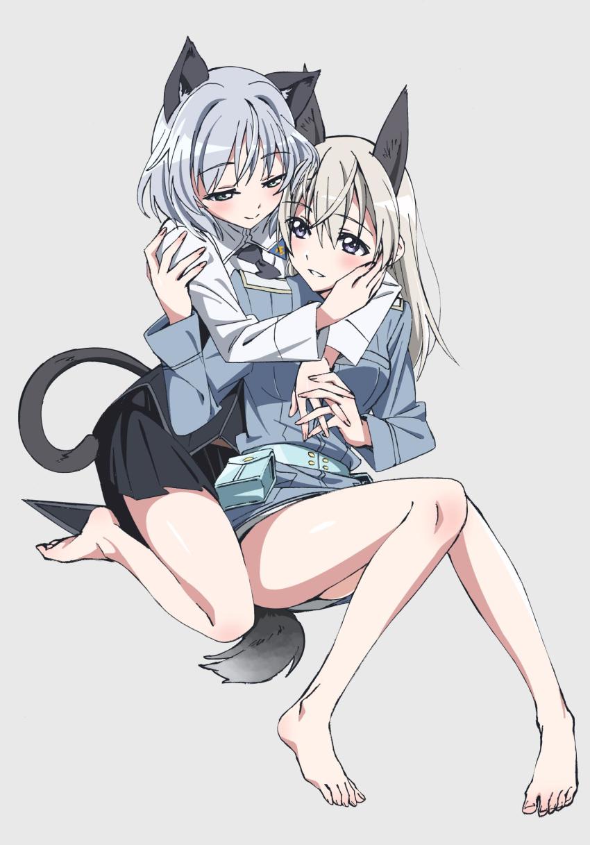 2girls, animal_ears, barefoot, belt, black_neckwear, black_skirt, blue_belt, blue_eyes, blue_jacket, blush, cat_ears, cat_tail, closed_mouth, commentary, dog_ears, dog_tail, dress_shirt, eila_ilmatar_juutilainen, grey_background, grey_hair, half-closed_eyes, hand_on_another's_face, highres, holding_hands, hug, hug_from_behind, interlocked_fingers, jacket, kogarashi51, long_hair, looking_at_another, looking_back, medium_hair, military, military_uniform, miniskirt, multiple_girls, necktie, missing_legwear, no_pants, parted_lips, pleated_skirt, sanya_v._litvyak, shirt, simple_background, sitting, skirt, smile, strike_witches, tail, white_shirt, wing_collar, world_witches_series, yuri