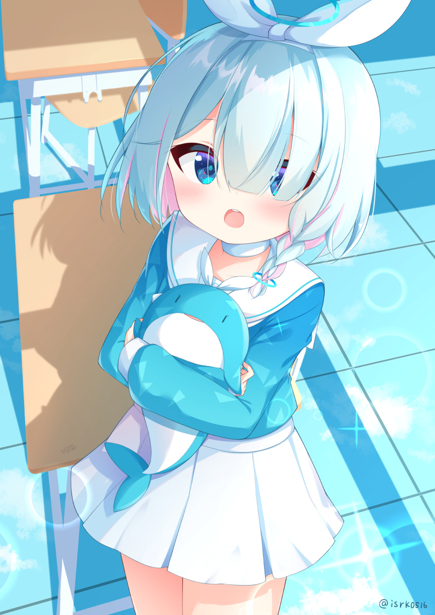 1girl, arona_(blue_archive), bad_id, bad_pixiv_id, blue_archive, blue_eyes, blue_hair, blush, braid, commentary_request, desk, hair_over_one_eye, headband, highres, isoroku_(isrk), looking_at_viewer, hugging_object, school_desk, school_uniform, shadow, short_hair, side_braid, stuffed_animal, stuffed_toy, twitter_username
