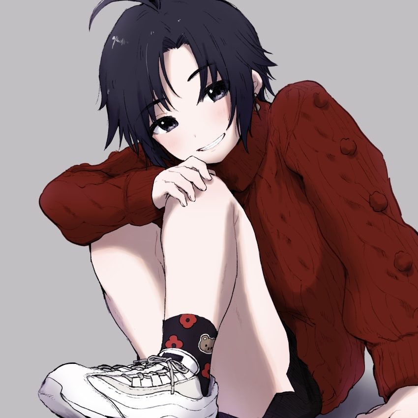 1girl, air_max_95, animal_print, antenna_hair, bare_legs, bear_print, black_eyes, black_hair, black_shorts, blush, earrings, grey_background, grin, hand_on_own_knee, head_tilt, highres, hiragana_(maru_kaku), idolmaster, idolmaster_(classic), idolmaster_million_live!, jewelry, kikuchi_makoto, knees_up, looking_at_viewer, nike_(company), parted_bangs, red_sweater, shoes, short_hair, short_shorts, shorts, simple_background, sitting, smile, sneakers, solo, sweater, tomboy