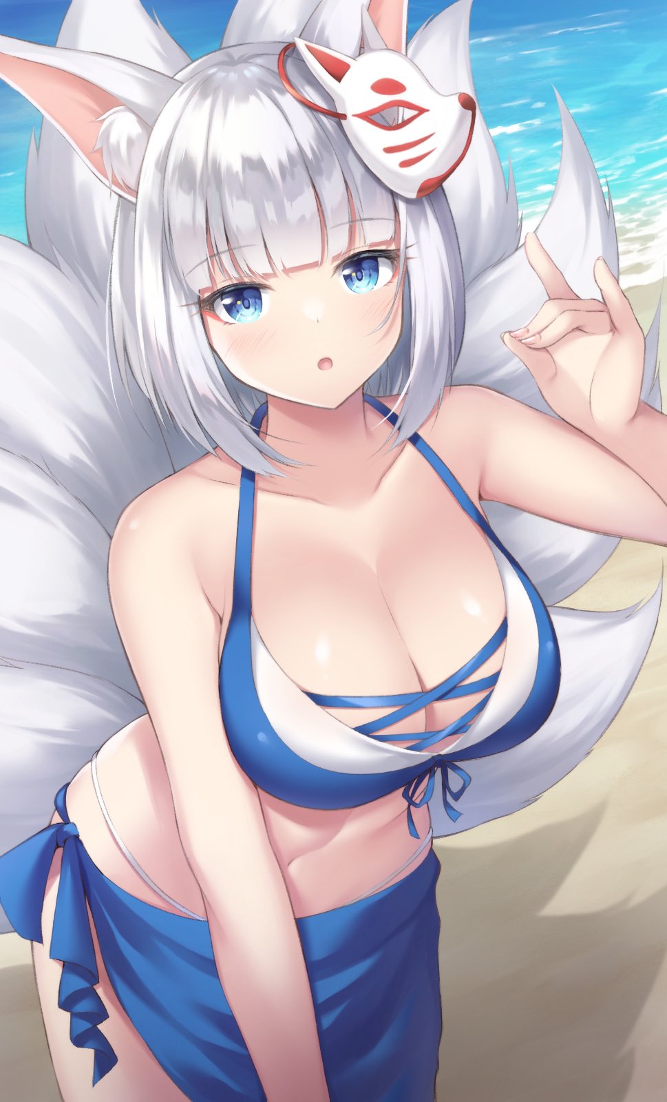 1girl, :o, animal_ear_fluff, animal_ears, azur_lane, beach, bikini, blue_bikini, blue_eyes, blush, breasts, cleavage, collarbone, commentary, commentary_request, fox_ears, fox_mask, fox_shadow_puppet, fox_tail, highres, kaga_(azur_lane), kaga_(everlasting_killing_stone)_(azur_lane), large_breasts, looking_at_viewer, mask, mask_on_head, navel, sakuba_nao, short_hair, solo, swimsuit, tail, water, white_hair