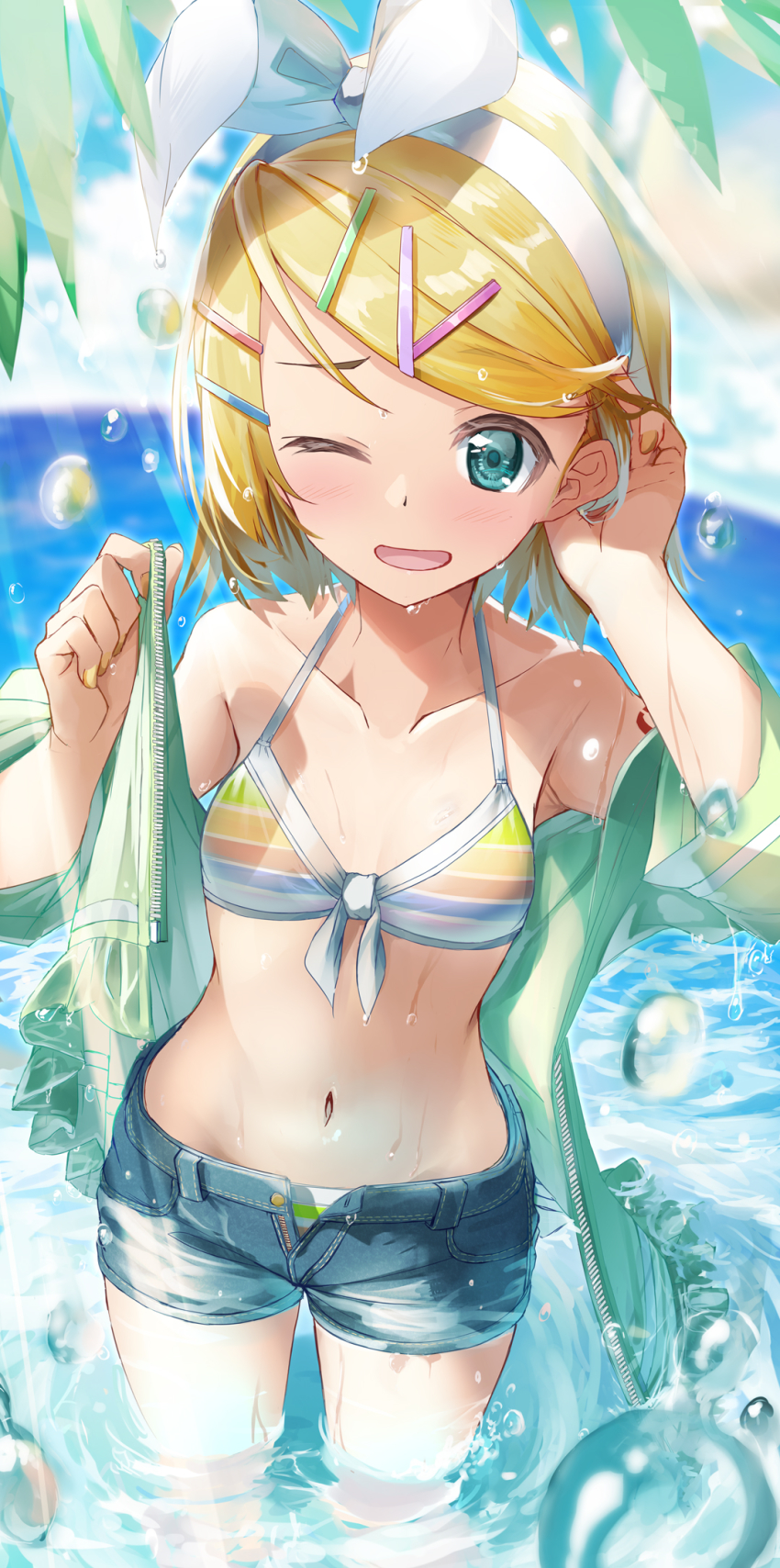 1girl, :d, aqua_eyes, arm_up, bikini, bikini_under_clothes, blonde_hair, blue_sky, bow, breasts, cloud, collarbone, commentary, curved_horizon, daidou_(demitasse), day, denim, denim_shorts, foreshortening, green_jacket, hair_bow, hair_ornament, hairclip, highres, jacket, kagamine_rin, kagamine_rin_(striped_bikini), leaf, light_rays, nail_polish, navel, ocean, one_eye_closed, open_mouth, outdoors, short_hair, shorts, sky, small_breasts, smile, solo, standing, striped_bikini, striped_clothes, sunbeam, sunlight, swimsuit, thighs, unbuttoned, vocaloid, wading, water_drop, wet