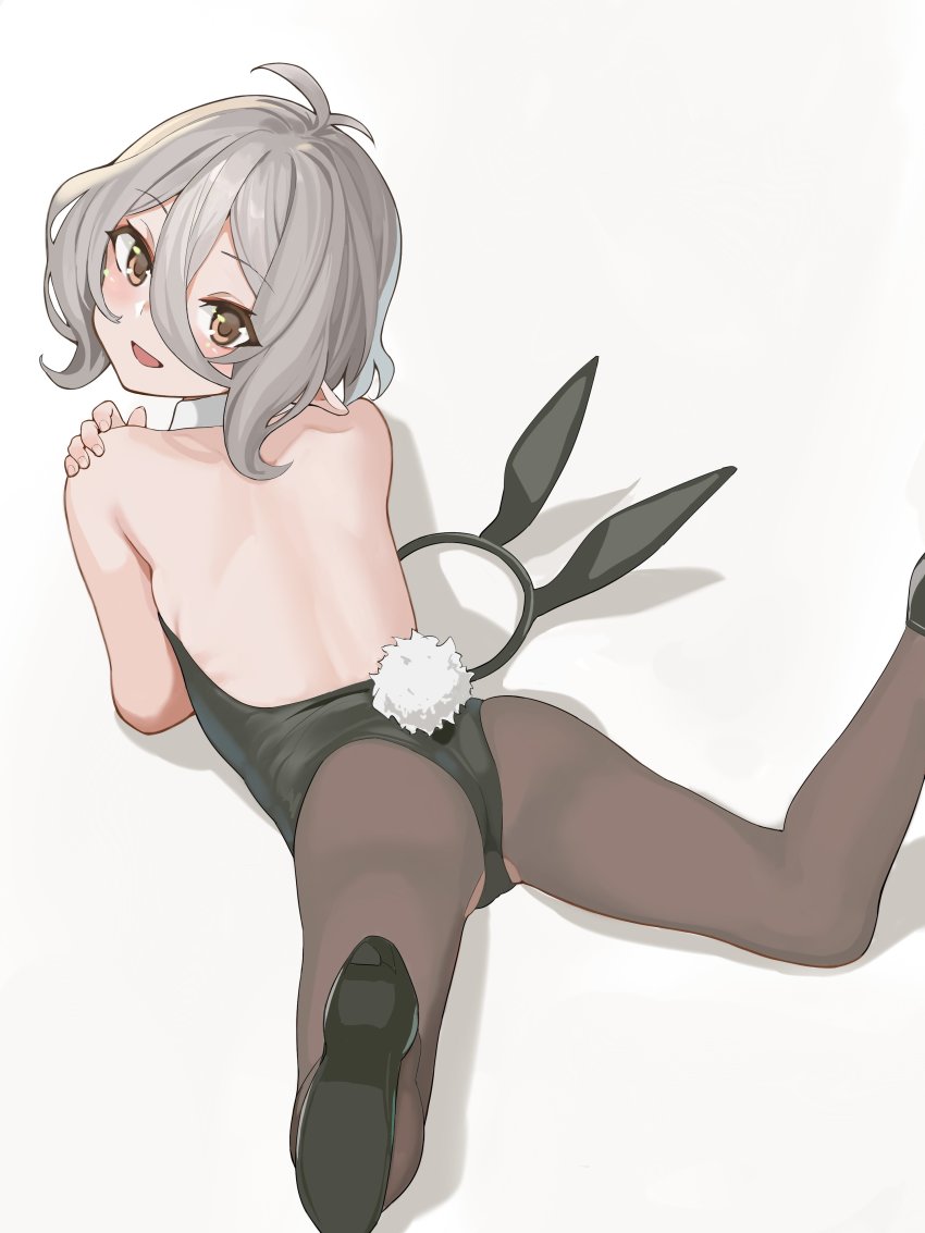 1girl, absurdres, alternate_costume, animal_ears, antenna_hair, backless, backless_dress, backless_outfit, black_footwear, black_leotard, black_pantyhose, blush, brown_eyes, dress, fake_animal_ears, fake_tail, female_focus, grey_background, grey_hair, hair_between_eyes, highres, hoshiya_takahito, kokkoro_(princess_connect!), leotard, loli, looking_at_viewer, lying, on_stomach, pantyhose, playboy_bunny, pointy_ears, princess_connect!, rabbit_tail, short_hair, simple_background, solo, tail