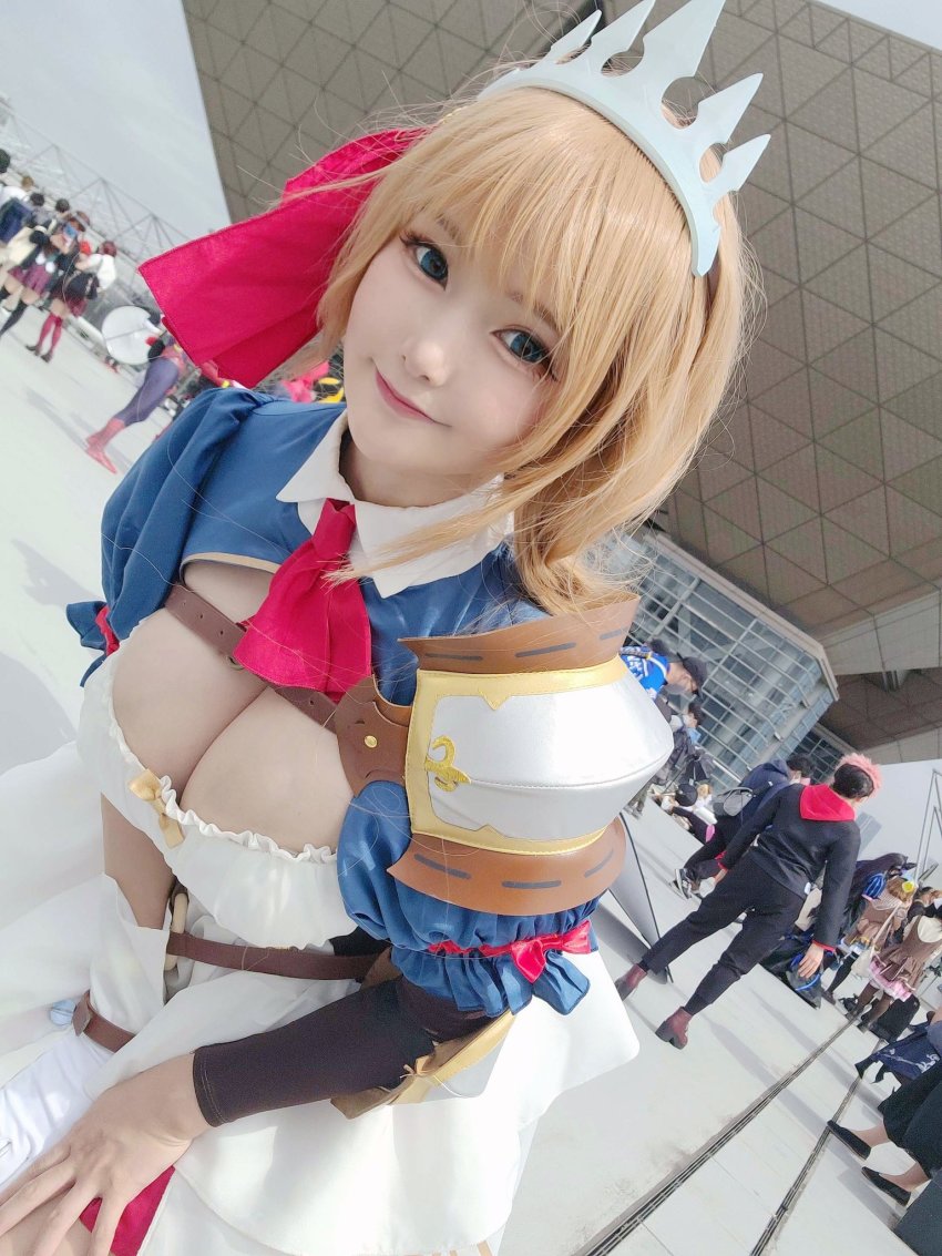 1girl, bent_over, blue_eyes, breasts, cleavage, cosplay, cosplay_photo, crown, dress, east_asian, highres, japanese_(nationality), large_breasts, looking_at_viewer, orange_hair, pecorine_(princess_connect!), pecorine_(princess_connect!)_(cosplay), photo_(medium), princess, princess_connect!, smile, white_dress