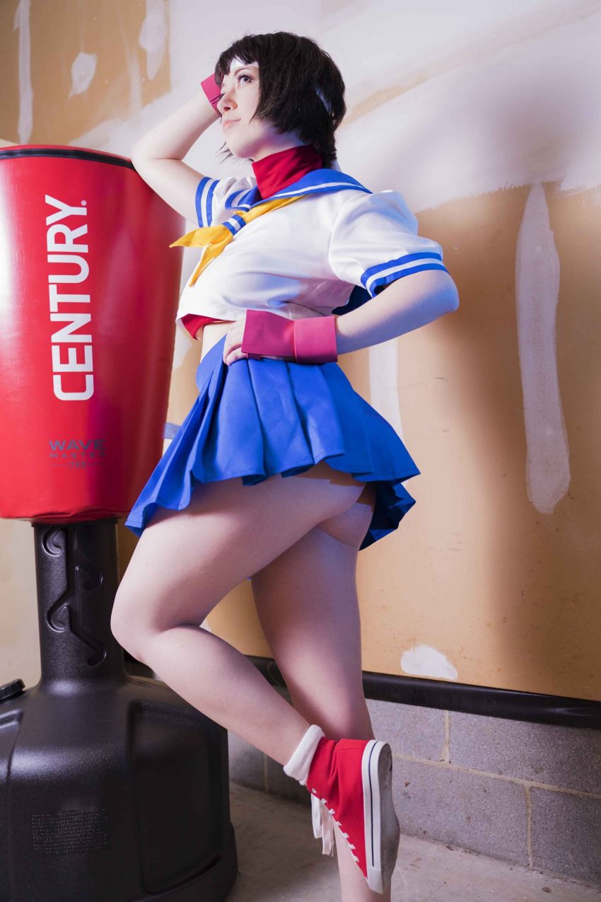 absurdres, ass, blue_skirt, converse, cosplay, fingerless_gloves, gloves, highres, kasugano_sakura, kasugano_sakura_(cosplay), legs, photo_(medium), skirt, street_fighter, usatame