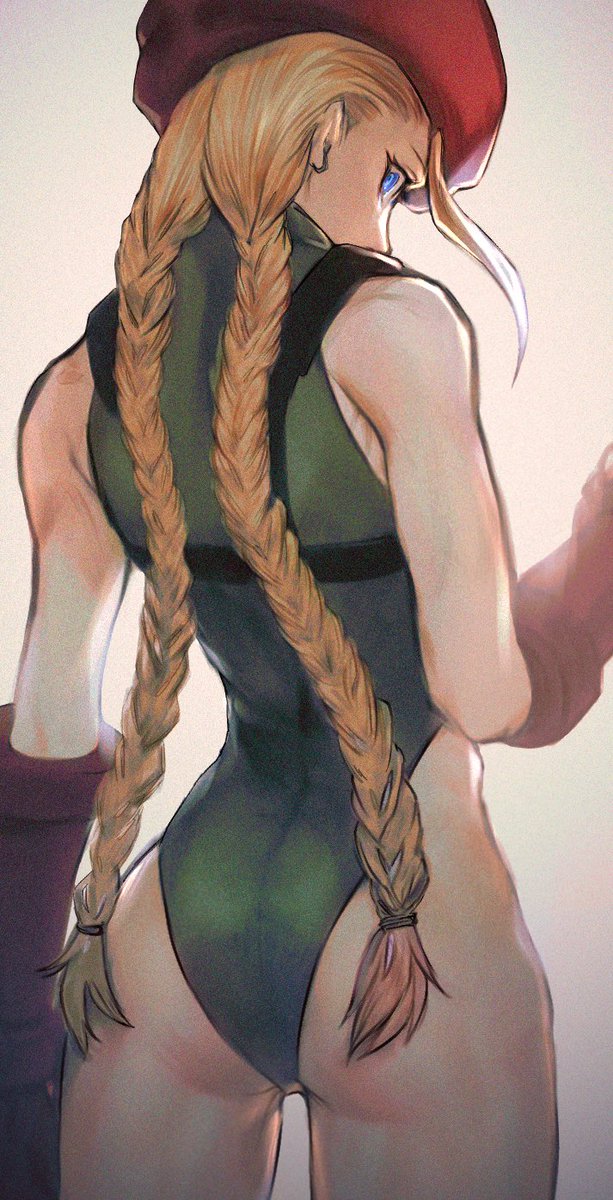 1girl, ahoge, ass, beret, blonde_hair, blue_eyes, cammy_white, chest_harness, clenched_hands, from_behind, green_leotard, harness, hat, highleg, highleg_leotard, highres, hitsuji_kusa, leotard, long_hair, looking_back, solo, street_fighter, street_fighter_v, twintails