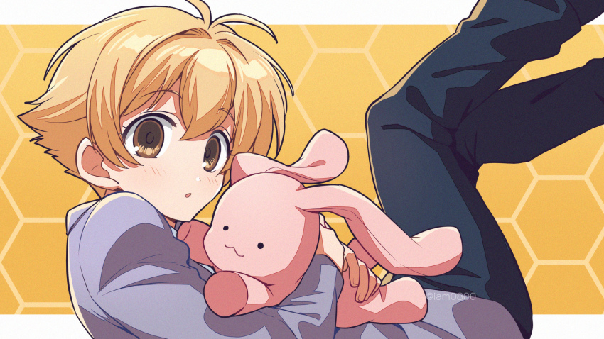 1boy, antenna_hair, asada_hachi, black_pants, blazer, blonde_hair, blush, commentary, from_side, haninozuka_mitsukuni, highres, holding, holding_stuffed_toy, honeycomb_(pattern), honeycomb_background, hugging_object, jacket, legs_up, long_sleeves, looking_at_viewer, male_focus, ouran_high_school_host_club, ouran_high_school_uniform, pants, parted_lips, purple_jacket, school_uniform, short_hair, solo, stuffed_animal, stuffed_rabbit, stuffed_toy, twitter_username, watermark, yellow_eyes