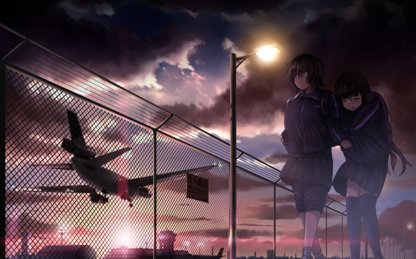 2girls, 99_(hosinosensei), aircraft, airplane, airport, black_hair, black_skirt, black_sky, blue_sky, chain-link_fence, closed_eyes, cloud, cloudy_sky, commentary_request, douglas_dc-10, fence, from_below, highres, jacket, jet_airliner, lamppost, landing, long_hair, looking_to_the_side, multiple_girls, original, outdoors, over-kneehighs, pants, short_hair, sign, skirt, sky, socks, sunset, thighhighs, track_jacket, track_pants, track_suit, walking, warning_sign, white_legwear