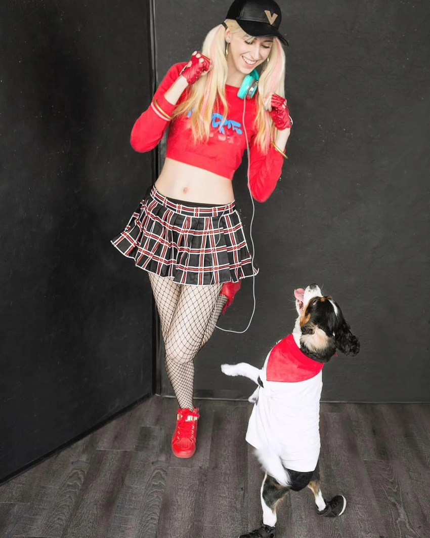 1girl, atlus, blonde_hair, breasts, cosplay, dog, earrings, erika_harlacher