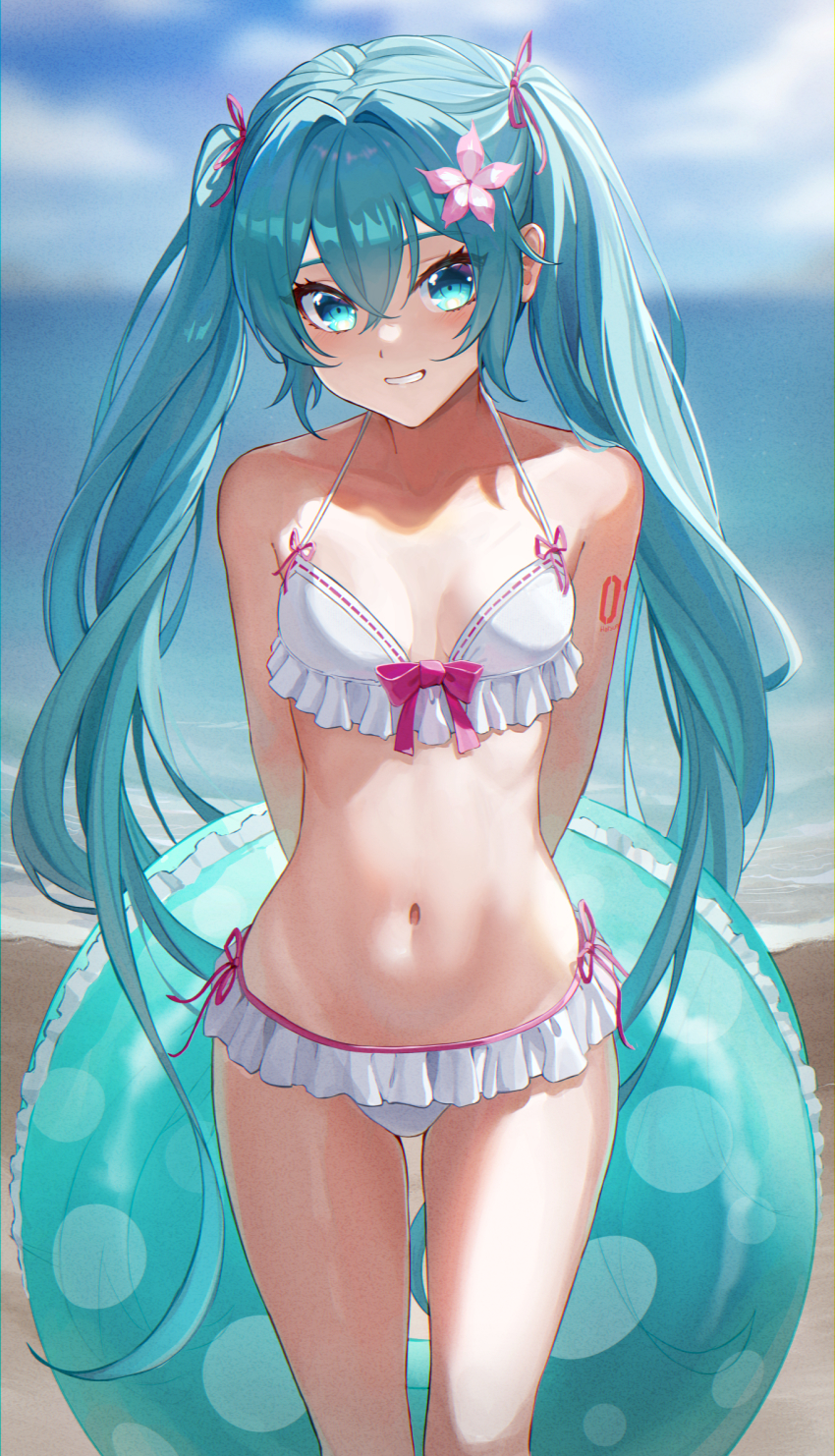 1girl, aqua_eyes, aqua_hair, arm_tattoo, arms_behind_back, bare_arms, bare_shoulders, beach, bib_(bibboss39), bikini, blurry, blurry_background, blush, bow, breasts, collarbone, cowboy_shot, crossed_bangs, flower, frilled_bikini, frills, grin, hair_flower, hair_ornament, hair_ribbon, halterneck, hatsune_miku, highres, holding, holding_swim_ring, innertube, long_hair, looking_at_viewer, navel, number_tattoo, ocean, pink_bow, ribbon, ribbon_trim, sand, sky, small_breasts, smile, solo, standing, stomach, swim_ring, swimsuit, tattoo, teeth, thighs, twintails, very_long_hair, vocaloid, white_bikini